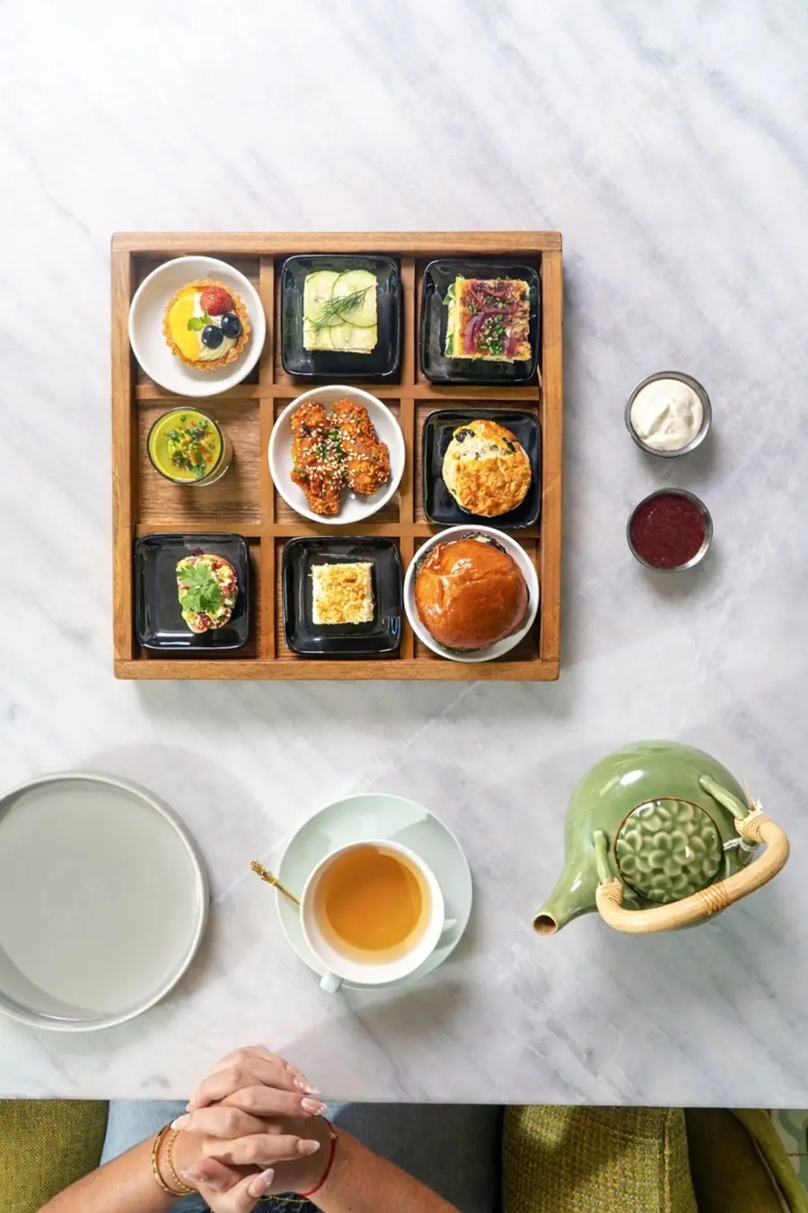 Overhead view of tea and assorted small dishes